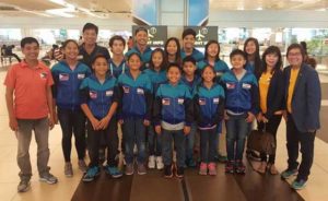 Philippine Swimming League (PSL) President Susan Papa, Secretary General Maria Susan Benasa, coaches Alex Papa and Joey Andaya with the first batch of athletes seeing action in the 2016 Singapore Invitational Swimming Championship. CONTRIBUTED PHOTO