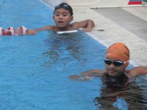 Marc Bryan Dula (top) and Micaela Jasmine Mojdeh receiving instructions from Philippine Swimming League President  Susan Papa during training at the Singapore Island Country Club in Singapore. CONTRIBUTED PHOTO 