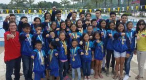 Philippine Swimming League President Susan Papa, Secretary General Maria Susan Benasa and the PSL swimmers that won 79 gold medals in the 2016 Singapore Invitational Swimming Championship recently held at the Singapore Island Country Club. CONTRIBUTED PHOTO