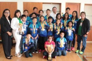 n Philippine Sports Commission Chairman William “Butch” Ramirez poses with the Philippine Swimming League (PSL) team that won 79 gold medals in Singapore. Also in the photo are PSL President Susan Papa, Secretary General Maria Susan Benasa, Regional Director Fiscal Theresa Mahiwo, coach Alex Papa and the Most Outstanding Swimmer awardees. CONTRIBUTED PHOTO 