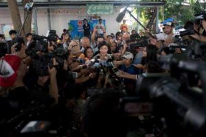 STILL IN THE SPOTLIGHT Former Thai prime minister Yingluck Shinawatra talks to the media after casting her ballot at her local polling station during the constitutional referendum in Bangkok on Sunday. AFP PHOTO