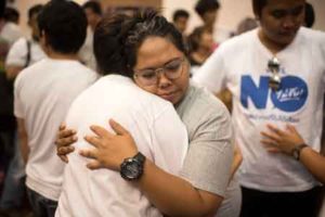 VICTORY HUG Thai members of the New Democracy hug after a ‘Yes’ victory in the Constitutional Referendum at Thammasat University on Sunday. Thailand voted Sunday to approve a junta-scripted constitution, preliminary results showed, in a boost to the army’s political aspirations and a body blow to the country’s stuttering prodemocracy movement. The military says its new constitution will curb endemic political corruption, bring stability after years of unrest and pave the way for a general election next year. AFP PHOTO