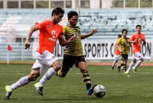 Loyola Meralco Sparks FC team captain James Younghusband (left) attempts to bust the defense of Laos FC’s Jhomar Almento (right) in a United Football League game at the Rizal Memorial Football Stadium on Wednesday. UFL PHOTO 
