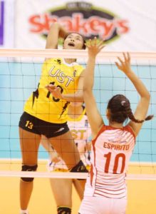 UST’s Jenn Gutierrez goes up for a kill against UE’s Satriani Espiritu during their Shakey’s V-League Collegiate Conference encounter at the Philsports Arena. CONTRIBUTED