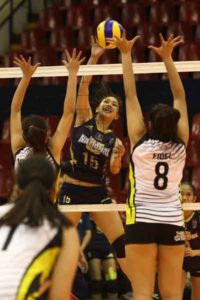 National U’s Audrey Paran hammers in a kill against TIP’s blockers, led by Rochelle Fidel (8) during their Shakey’s V-League Collegiate Conference duel at the Philsports Arena. CONTRIBUTED PHOTO