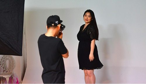 South Korean plus-size model Vivian Geeyang Kim poses for a photo shoot in order to update her online clothing shop at a studio in Seoul. AFP PHOTO