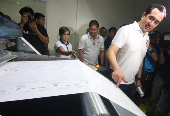 Commission on Elections Chairman Andres Bautista checks an official ballot being printed by the National Printing Office for the upcoming barangay and Sangguniang Kabataan elections. The NPO will print 85 million ballots for the electoral exercise in October. PHOTO BY RUY L. MARTINEZ