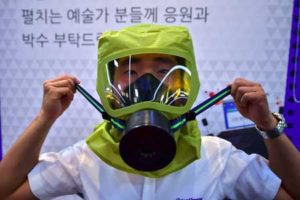 PREPARING FOR THE WORST A South Korean man wears a gas mask as he takes shelter during a civil defense drill against possible attacks by North Korea in Seoul on Wednesday. South Korea and the United States kicked off large-scale military exercises on Monday, triggering condemnation and threats of a pre-emptive nuclear strike from North Korea. AFP PHOTO