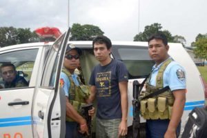 SAFE AT LAST Policemen escort Indonesian Muhamad Sofyan as he leaves a hospital in Jolo where he had a medical check-up shortly after escaping from his Abu Sayyaf captors. AFP PHOTO