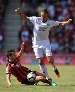 Manchester United’s Swedish striker Zlatan Ibrahimovic nips the ball past the challenge of Bournemouth’s English-born Irish midfielder Harry Arter (left) during the English Premier League football match between Bournemouth and Manchester United at the Vitality Stadium in Bournemouth, southern England on Monday. AFP PHOTO