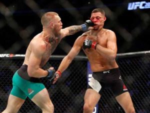 Conor McGregor (left) hits Nate Diaz with a left during their welterweight rematch at the UFC 202 event at TMobile Arena in Las Vegas, Nevada. AFP PHOTO