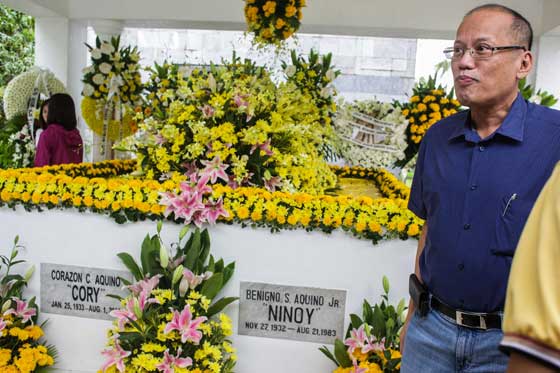 Former president Benigno Aquino 3rd stands near the tomb of his father as he and his sisters and supporters marked the 33rd death anniversary of Benigno Aquino Jr. at the Manila Memorial Park in Parañaque City. Aquino Jr. was assassinated on August 21, 1983 upon his arrival the Manila International Airport. PHOTO BY DJ DIOSINA