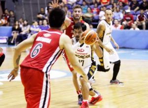 Mahindra’s Manny Pacquiao avoiding the sticky defense of Blackwater’s Imad Qahwash during the elimination round of the Philippine Basketball Association Governors’ Cup at the Araneta Coliseum. CONTRIBUTED PHOTO