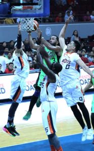 GlobalPort’s Stanley Pringle drives to the basket against Jared Dilinger, Allen Durham and Bryan Faundo of Meralco during the Philippine Basketball Association Governors’ Cup elimination round at the Mall of Asia Arena in Pasay City. BOB DUNGO JR.