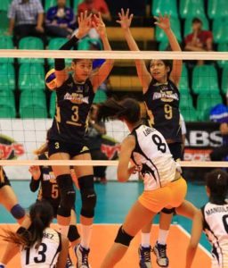 UST guest player Eya Laure (8) mocks NU’s Jaja Santiago and Aiko Urdas’ defense as she hammers in a kill during their Shakey’s V-League Collegiate Conference quarterfinals showdown. CONTRIBUTED PHOTO