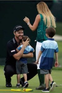 Jimmy Walker of US celebrates with his wife Erin and sons Beckett and Mclain after making par on the 18th hole to win the 2016 PGA Championship at Baltusrol Golf Club in Springfield, New Jersey. AFP PHOTO