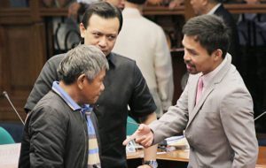 PACMAN VS HIT MAN Senator Emmanuel Pacquiao (right) talks to confessed ‘Davao Death Squad’ hit man Edgar Matobato at the resumption of a Senate inquiry on alleged summary killings on Thursday. Pacquiao was among those who grilled the former militiaman who claims President Rodrigo Duterte was behind the killings of 1,000 people between 1988 and 2013. PHOTO BY BOB DUNGO  JR.