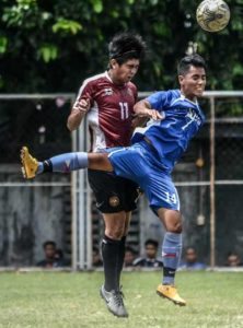 University of the Philippines center back Ian Clarino (left) mounts a header in their previous game against Ateneo de Manila University in Ang Liga. ANG LIGA PHOTO