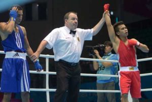 Mark Anthony Barriga (right) defeats Syria’s Hussin Al Masri (left) in the men’s boxing light fly 46-49 kgs preliminaries session 4 during the 2014 Asian Games in Incheon on September 25, 2014. AFP PHOTO