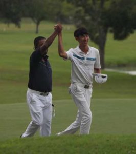 Tony Lascuna (left) raises Micah Shin’s hand in triumph after the young Korean-American edged the veteran campaigner by 2 to claim his maiden pro win. CONTRIBUTED PHOTO