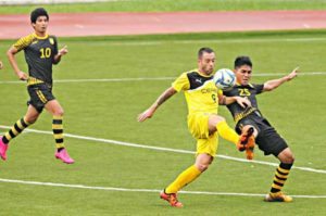 Ceres La Salle FC’s striker Adrian Gallardo Valdes of Spain (No.9) penetrates through the defense of Laos FC in the United Football League on Wednesday.  UFL Media photo