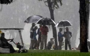 Players take cover as heavy rain stopped play in the opener of the ICTSI TPC Championship at Wack Wack. CONTRIBUTED PHOTO