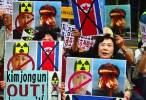 South Korean conservative activists hold placards showing the portrait of North Korean leader Kim Jong-Un during a protest denouncing North Korea’s nuclear test in Seoul. AFP PHOTO