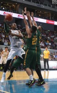 Ben Mbala of DLSU defends the ball against Richard Escoto and Prince Orizu of FEU during a UAAP basketball elimination rounds game at the Mall of Asia Arena in Pasay City. PHOTO BY RUSSELL PALMA