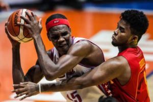 Mapua’s Joseph Eriobu guards against EAC’s center Hamadou Laminou (15) during an NCAA Season 92 men’s basketball game at The Arena in San Juan City on Thursday. PHOTO BY DJ DIOSINA