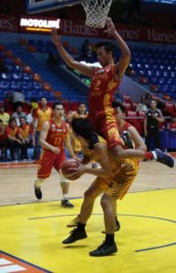 Jordan Dela Paz of JRU fakes a shot against Michael Calma of SSC-R during an NCAA men’s basketball game  at the San Juan Arena. Photo by Russell Palma 