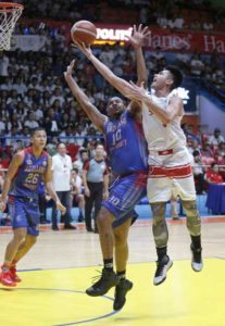 Javee Mocon of San Beda scores against Dioncee Holts of Arellano U during a NCAA men’s basketball game at the San Juan Arena on Tuesday. PHOTO BY RUSSELL PALMA