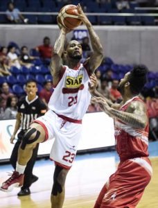 Star Hotshots import Joel Wright fires a jumper over Phoenix import Eugene Phelps during a PBA Season 41 Governors’ Cup game at the Araneta Coliseum on Friday. CONTRIBUTED PHOTO  