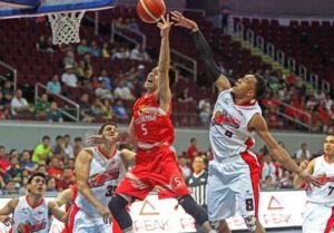 Calvin Abueva of Alaska blocks a shot by Lee Gwan Hee of Phoenix during a Philippine Basketball Association Season 41 Governors Cup game at the Mall of Asia Arena in Pasay City on Saturday. CONTRIBUTED PHOTO