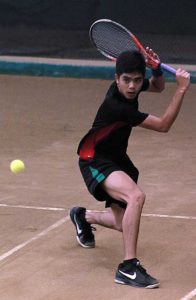 Argil Lance Canizares delivers a crisp backhand against Medhir Goyal of India during the first round of the 35th Philippine Columbian Association (PCA) Open-Cebuana Lhuillier ATF Tour on Thursday at the PCA indoor shell-clay court in Paco, Manila.  BOB DUNGO JR. 