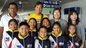 Philippine Swimming League President Susan Papa and Secretary General Maria Susan Benasa, and coaches Alex Papa and Aidar Umih with the first batch of swimmers seeing action in the 22nd SSC Open Invitational Midget Meet. CONTRIBUTED PHOTO