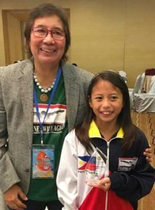 Philippine Swimming League (PSL) standout Aubrey Tom shows her Most Outstanding Swimmer award with PSL President Susan Papa. CONTRIBUTED PHOTO