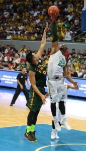 Ben Mbala of DLSU blocks the shot of Raymar Jose of FEU during a UAAP elimination rounds game at the Mall of Asia Arena in Pasay City. PHOTO BY RUSSELL PALMA