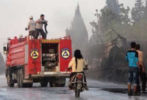 UNDER ATTACK Members of the Syrian Civil Defense extinguish burning trucks carrying aid on the side of the road in the town of Orum al-Kubra on the western outskirts of the northern Syrian city of Aleppo on Tuesday, the morning after a convoy delivering aid was hit by a deadly air strike. The United Nations said at least 18 trucks in the 31-vehicle convoy were destroyed en route to deliver humanitarian assistance to the hard-to-reach town. AFP PHOTO