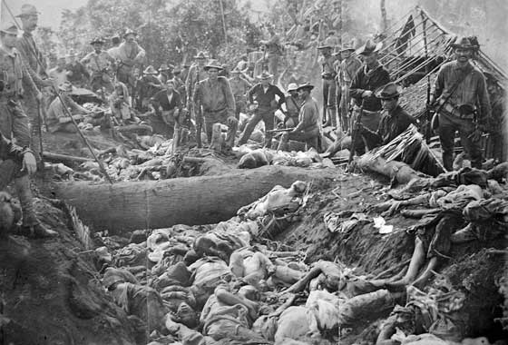 Photo shows American soldiers beside the corpses of Tausugs killed in the ‘forgotten’ massacre of Bud Dajo in Sulu in March 1906, a historical event raised by President Rodrigo Duterte at the close of the Association of Southeast Asian Nations summits in Laos, to ‘silence’ international critics of his bloody war on drugs. RAREHISTORICALPHOTOS.COM