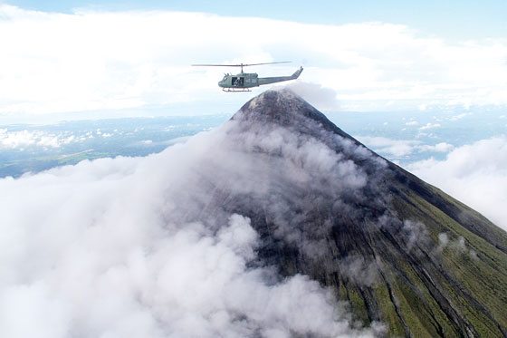  A helicopter carrying government officials flies near the summit of restive Mayon volcano. Officials from the Office of Civil Defense, Regional Disaster Risk Reduction and Management Council and Philippine Institute of Volcanology and Seismology conducted an aerial survey to evaluate the condition of the volcano. PHOTO BY RHAYDS BARCIA 