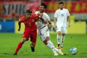 Iran’s Ramin Rezaeian (front right) fights for the ball with China’s Zhang Yuning during their 2018 World Cup qualifying football match in Shenyang, northeast China’s Liaoning province, on Wednesday. AFP PHOTO