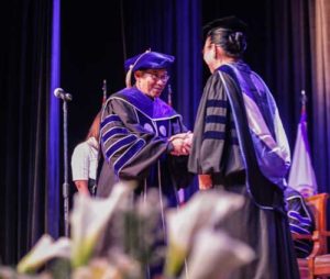 NEW PRESIDENTCommission on Higher Education Chairman Patricia Licuanan congratulates Fr. Marcelo Manimtim after his oath-taking. PHOTO BY DJ DIOSINA