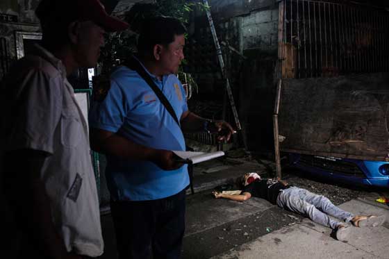 Photo shows a drug suspect slain in Tondo, Manila, allegedly by unidentified men. PHOTO BY DJ DIOSINA