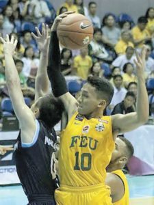 Far Eastern University’s Wendelino Comboy gets the rebound against Adamson University’s Robbie Manalang during the first round of the University Athletic Association of the Philippines Season 79 men’s basketball tournament at the Araneta Coliseum.  BOB DUNGO JR.