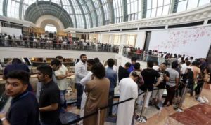 Customers queue outside a US tech-giant Apple store during the launch of the new iPhones on Saturday, at the Mall of the Emirates in Dubai. AFP PHOTO