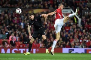 Manchester United’s Swedish striker Zlatan Ibrahimovic (right) vies in the air with Zorya’s Belarusian defender Mikhail Sivakov as he heads the ball towards goal during the UEFA Europa League group A football match between Manchester United and Zorya Luhansk at Old Trafford stadium in Manchester, north-west England, on Friday.  AFP PHOTO