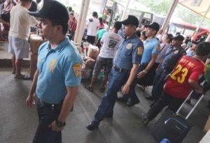 In Quezon City, patrol security in a bus terminal after authorities placed Metro Manila on full alert. RUY MARTINEZ