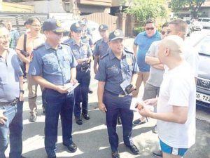 ‘TOKHANG’ IN RICH ENCLAVES Police visit posh villages in Makati City on Monday to urge residents to report ‘suspicious activities’ in their areas and cooperate with the government’s antidrug campaign. PHOTO BY MICHAEL JOE T. DELIZO