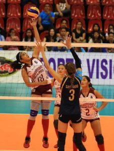 Diana Carlos (18) of University of the Philippines goes for a drop shot against National University’s Jaja Santiago during their key Shakey’s V-League Collegiate Conference encounter at the Philsports Arena. UP and NU will be battling in the best-of-three semifinal series beginning today. CONTRIBUTED PHOTO 