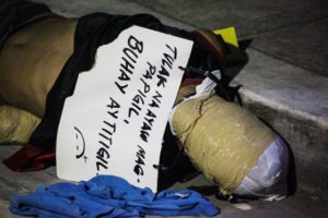 DEAD IN SAMPALOC Photo shows man, with head wrapped in packaging tape, found dead on Florentino Street corner Lacson Street in Sampaloc, Manila on October 1. A sign left on the scene claims the victim was a drug peddler. More than 3,000 drug suspects have been killed since the government launched a campaign against llegal drugs on July 1. PHOTO BY DJ DIOSINA 